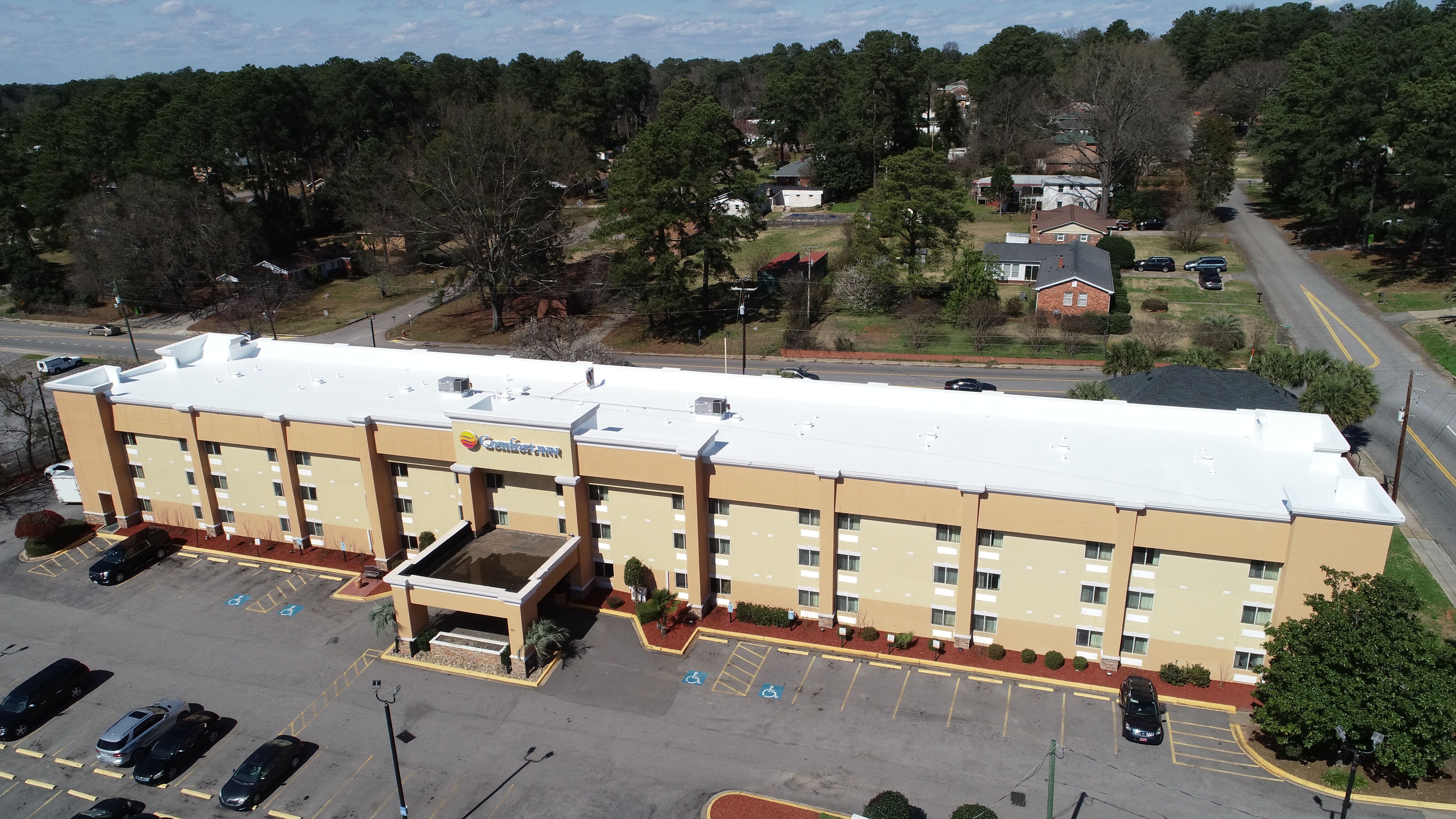 Weather-resistant fabric reinforced roofing system showing exceptional resistance to hail, high winds, and ponding water conditions