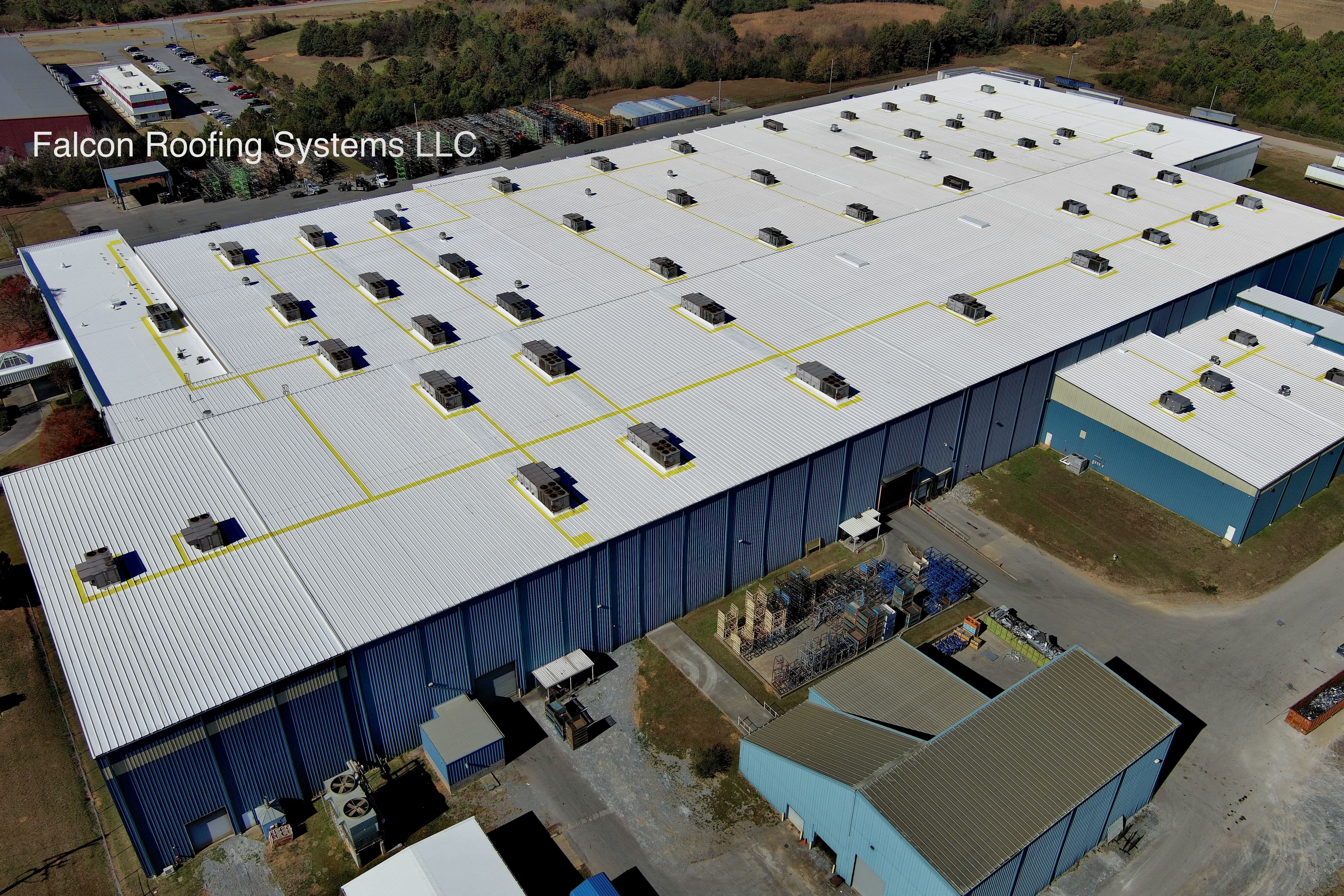 Completed metal roof restoration project by Falcon Roofing Systems showcasing like-new condition and cost-effective alternative to replacement