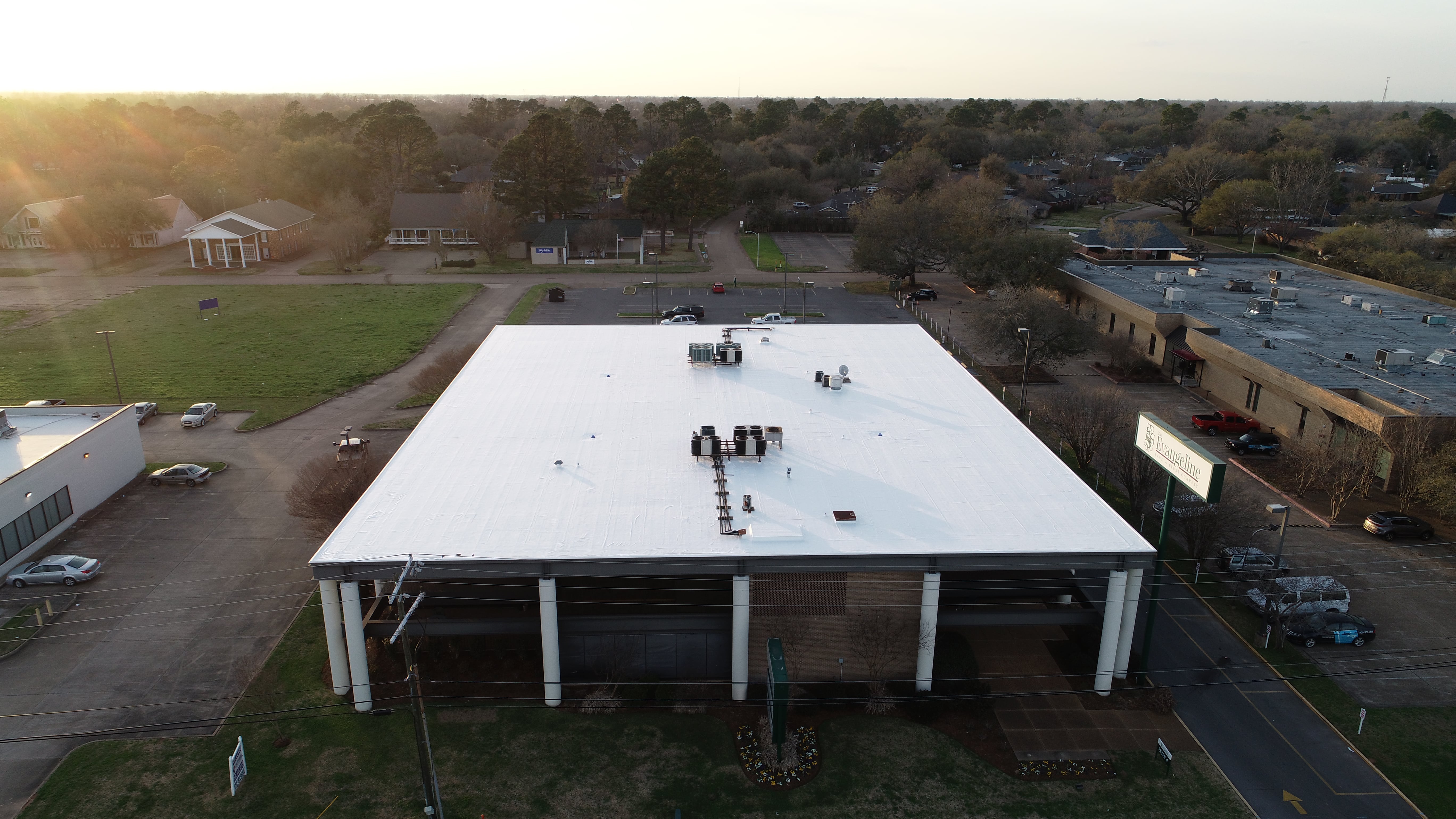 Aerial view of completed spray foam roofing project demonstrating seamless waterproof barrier installation with no seams or joints for maximum protection