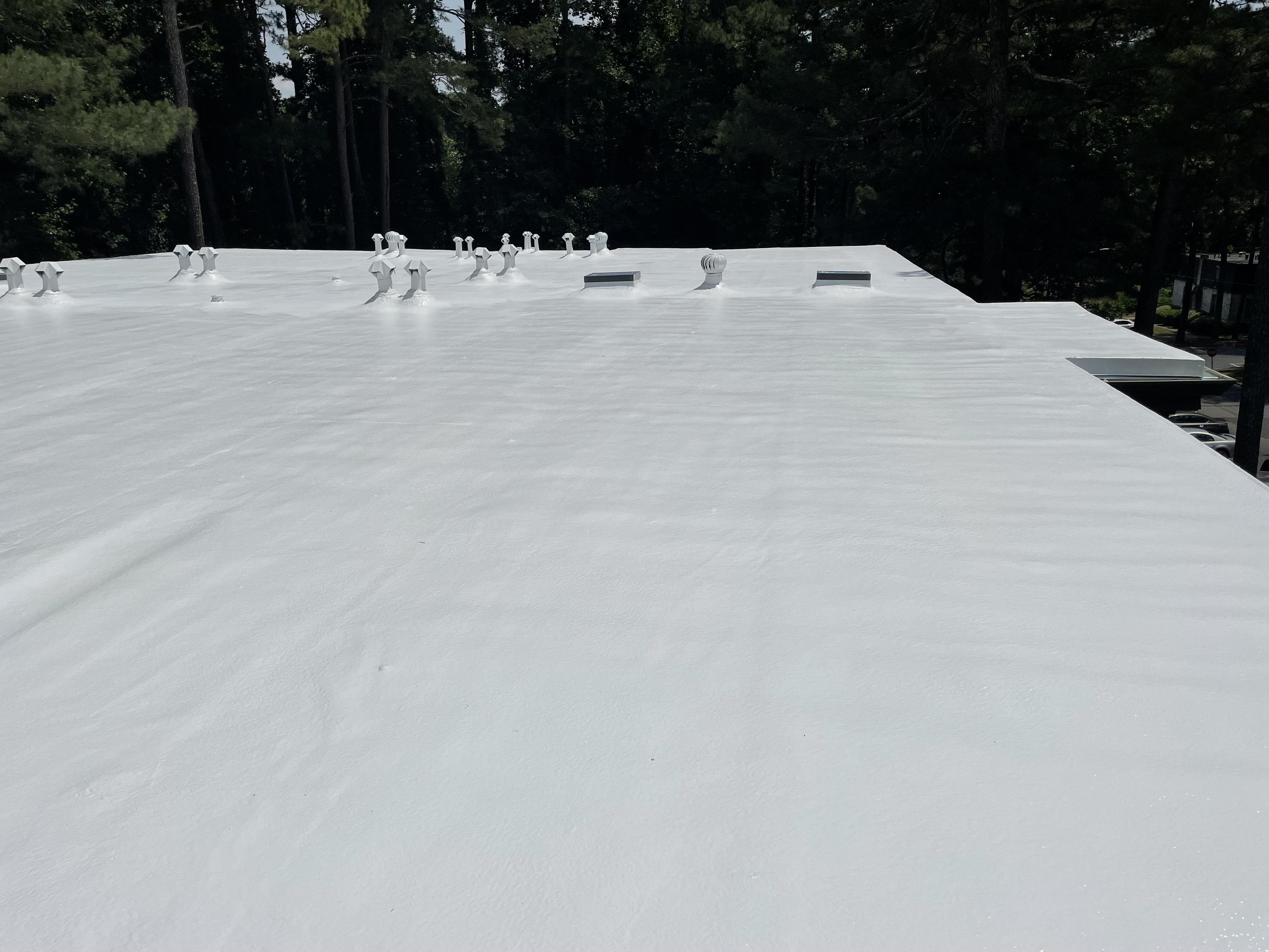 Completed spray foam roofing system by Falcon Roofing Systems providing up to 40% energy cost reduction and decades of reliable protection